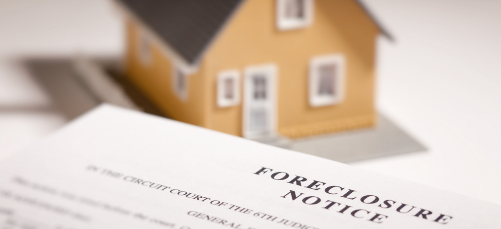 A foreclosure notice document in sharp focus with a blurred house in the background, illustrating the urgency of avoiding foreclosure through quick home sales.